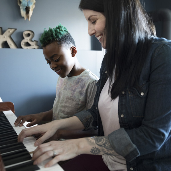 Parent and child at piano