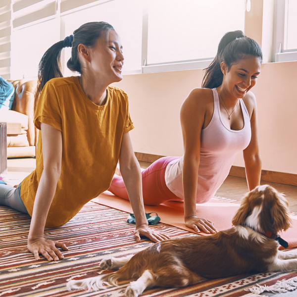 two ladies practicing yoga