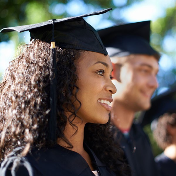 Woman graduate in cap and gown