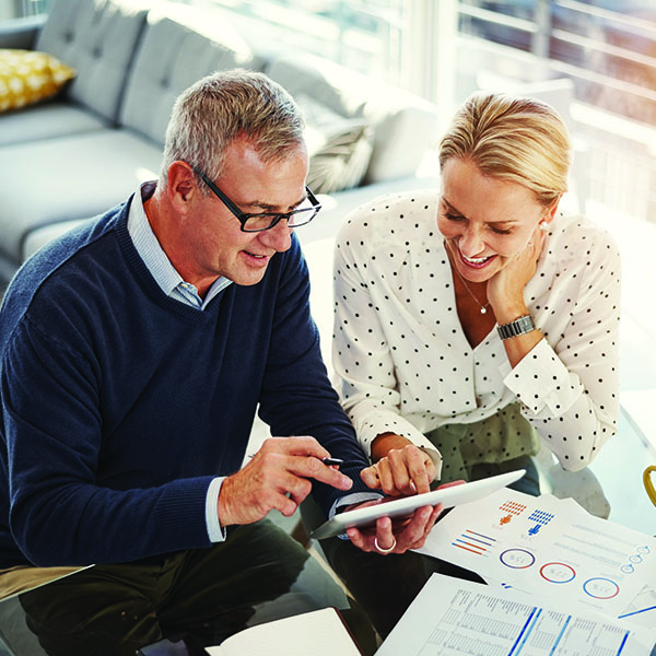Man and woman looking at charts
