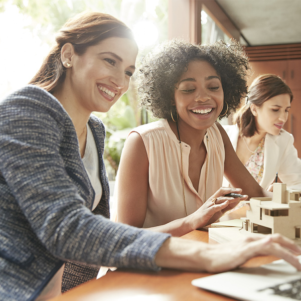 Female co-workers working on a computer training module together