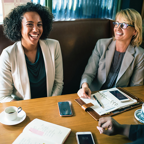 Two professional women sharing business advice