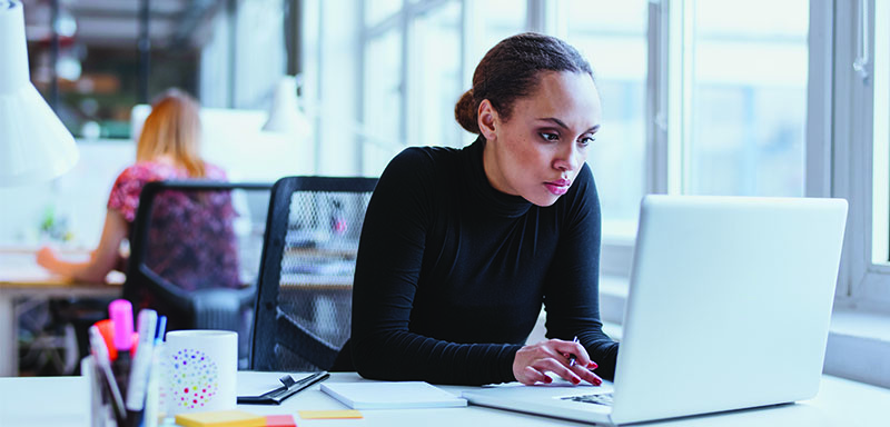 lady at desk working on computer