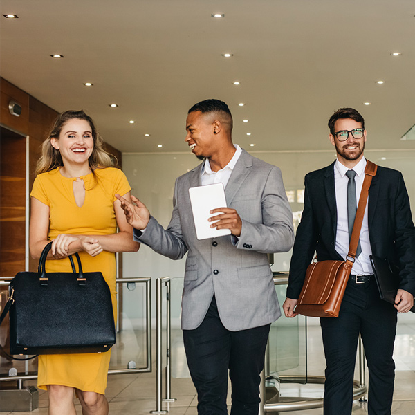 Diverse business employees walking down a hallway