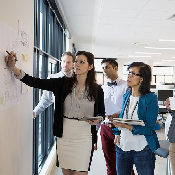 group looking at board