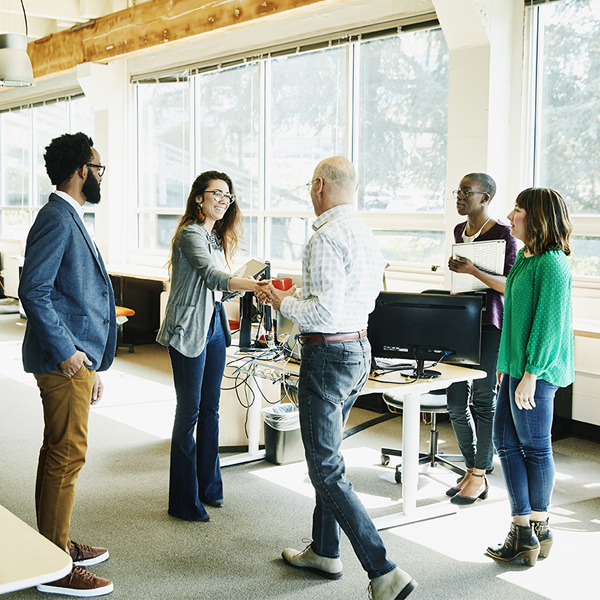 Employees talking in a business lobby