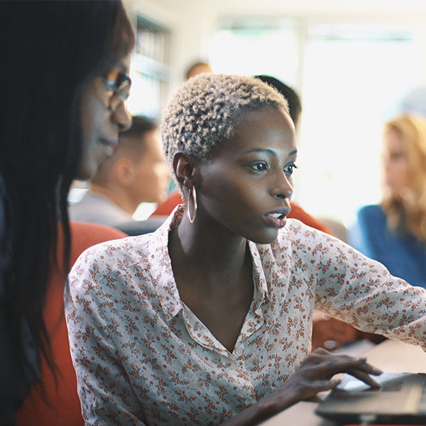 Woman seated in front of laptop