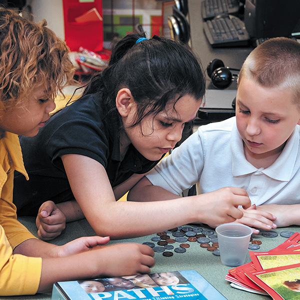 Children sharing supplies in a learning environment