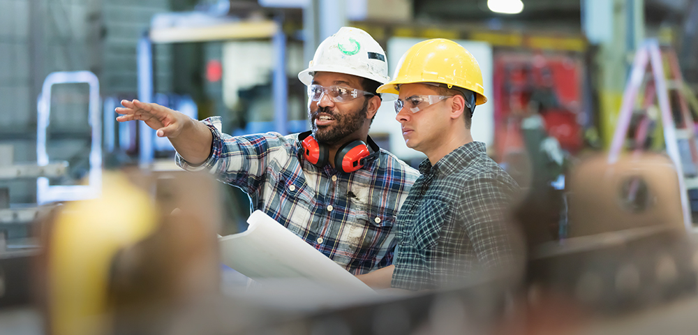 Construction workers looking over plans