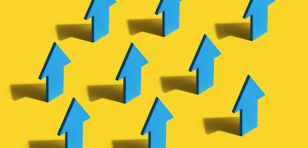 Blue arrows against yellow backdrop