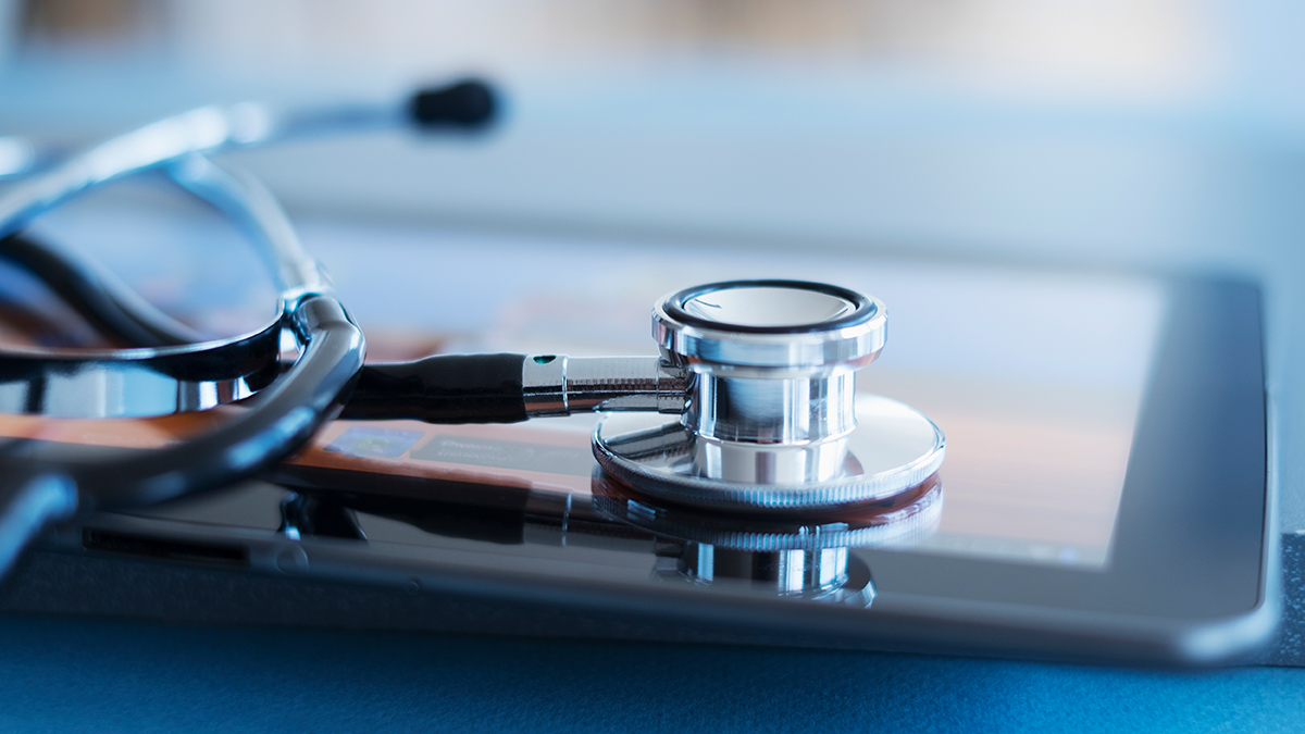 Stethoscope on top of tablet