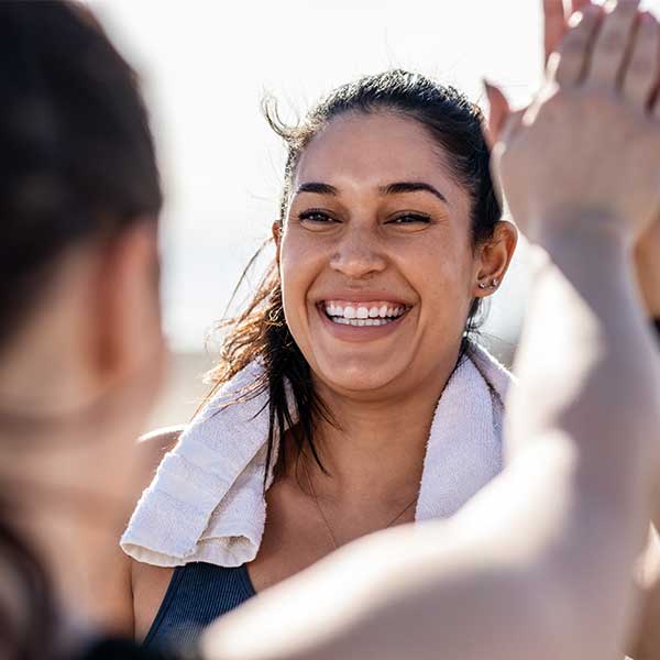two females high-fiving