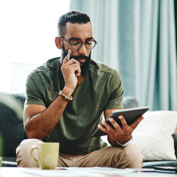 man looking at a tablet