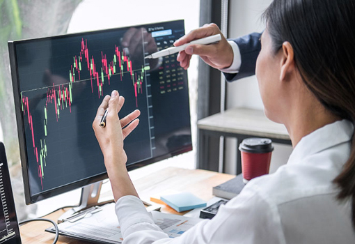 woman reviewing computer monitor