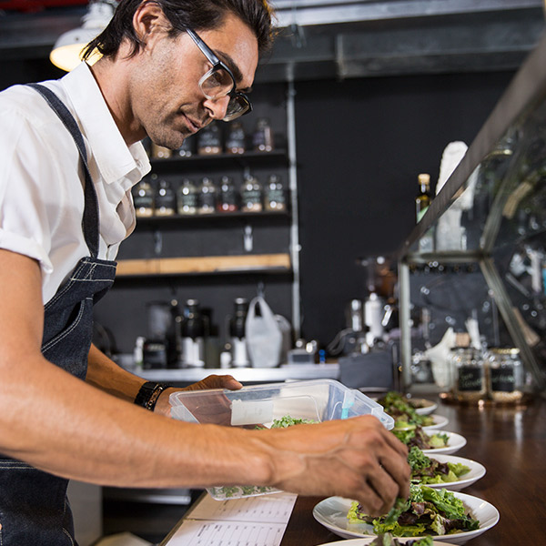 male chef preparing salads