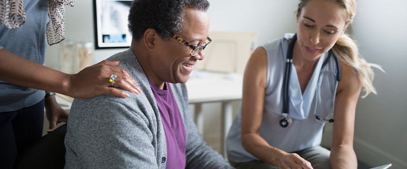 doctor reviewing chart with male patient