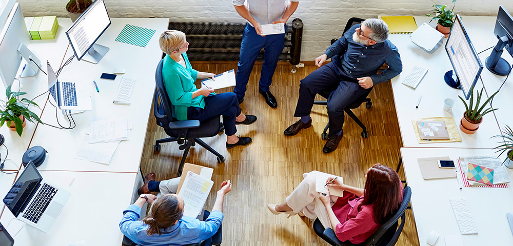 Business people sitting in chairs talking
