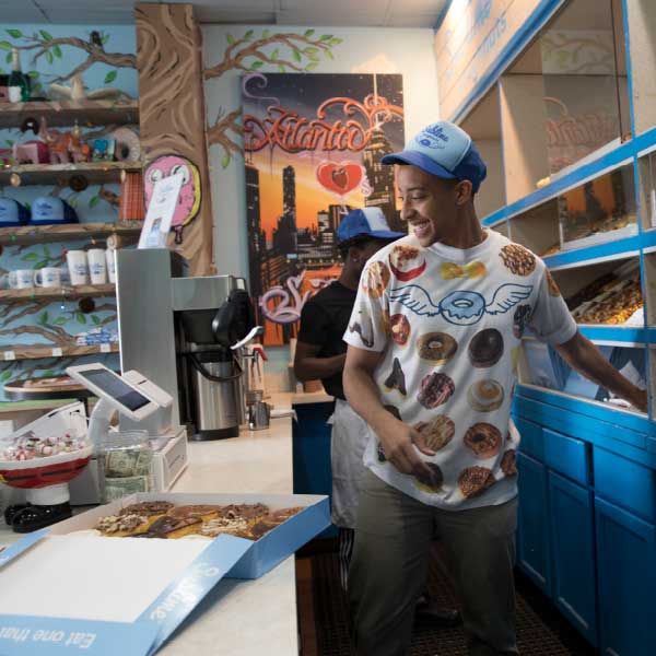 man working in donut shop