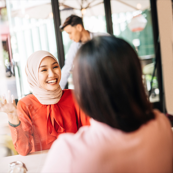 Women smiling and working together