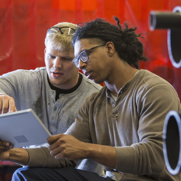 two guys on a tablet