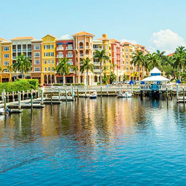 view from bay looking back at a coast of docks and colorful buildings