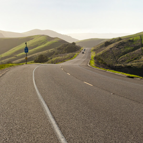 road winding through green mountains