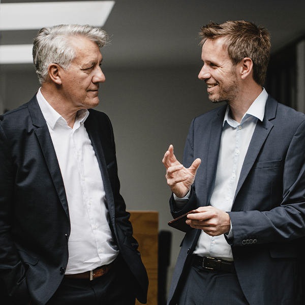 Two business men conversing